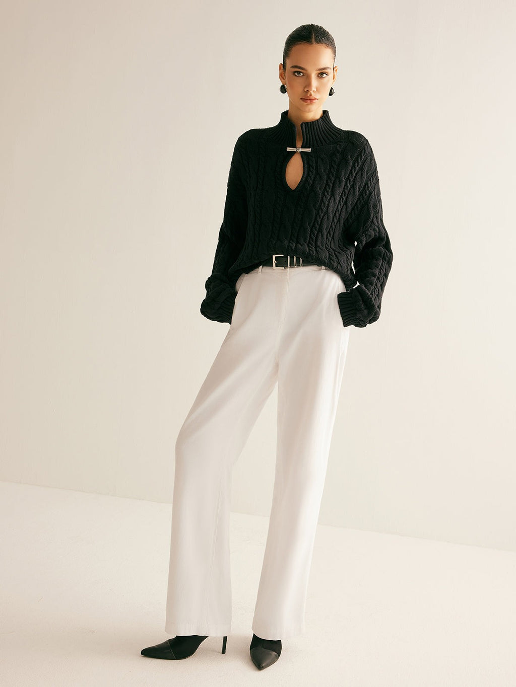 Cable knit keyhole high neck jumper